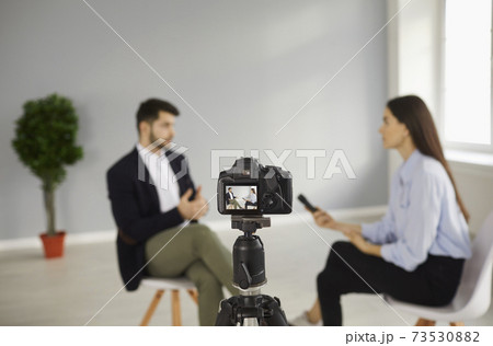 Digital video camera recording interview with famous person in television studio Digital video camera recording interview with famous person in television studio 73530882