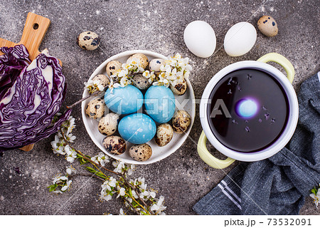 Process of painting Easter eggs in blue Process of painting Easter eggs in blue 73532091