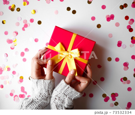 hands hold a gift on a white background 73532334