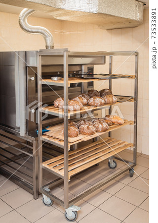 fresh loaves of bread on the shelves in the bakery fresh loaves of bread on the shelves in the bakery 73533891