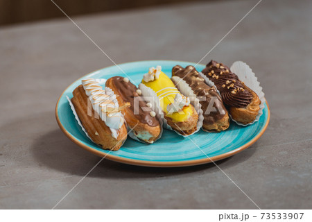Eclairs with different ganache and icing with different toppings Eclairs with different ganache and icing with different toppings 73533907
