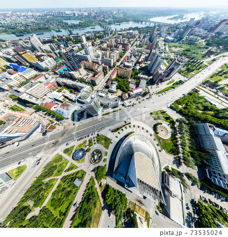 Aerial city view with roads, houses and buildings. Aerial city view with roads, houses and buildings. 73535024