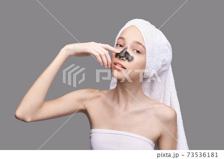 Young girl in studio. Bathroom towel. Cosmetology concept. Skin care product 73536181