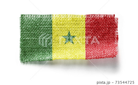 Senegal flag on a piece of cloth on a white background Senegal flag on a piece of cloth on a white background 73544725