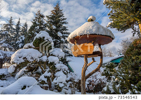 beautiful signpost in winter garden 73546543