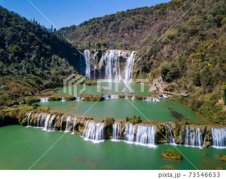 Aerial view of Jiulong waterfall in Luoping, Yunnan, China. Aerial view of Jiulong waterfall in Luoping, Yunnan, China. 73546633