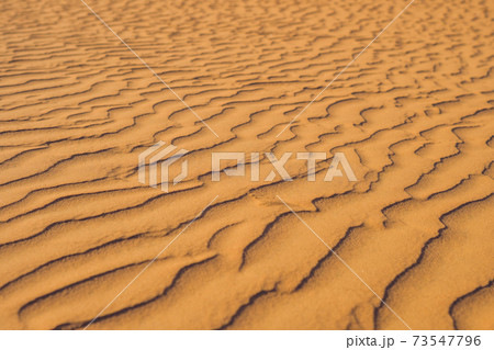 Sand with waves in the red desert Sand with waves in the red desert 73547796