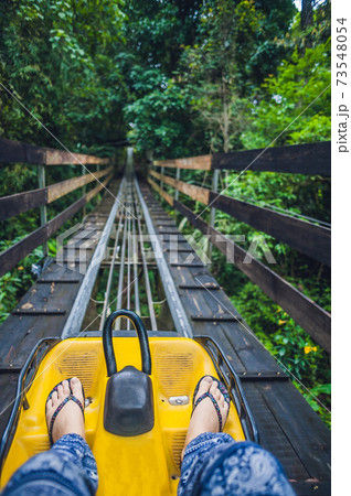 Feet of a young woman on Alpine Coaster Feet of a young woman on Alpine Coaster 73548054