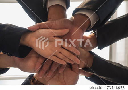 Hand business team overlapping view below. 73548083