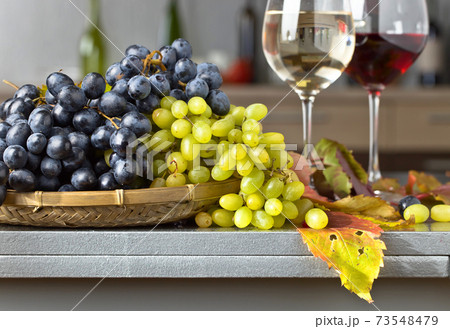 Ripe juicy grape and glass of wine Ripe juicy grape and glass of wine 73548479
