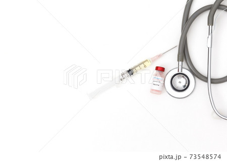 Close up covid-19(corona virus) vaccine on white background. 73548574