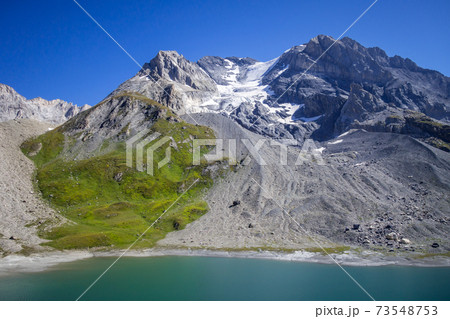 Long lake and Grande Casse Alpine glacier in French alps Long lake and Grande Casse Alpine glacier in French alps 73548753