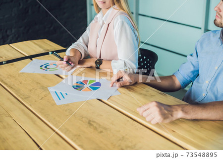 Young, attractive professionals having business training Young, attractive professionals having business training 73548895