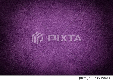 Purple matte background of suede fabric with vignette. Texture of velvet textile 73549083