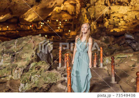Woman tourist in Hang Sung Sot Grotto Cave of Surprises, Halong Bay, Vietnam 73549436