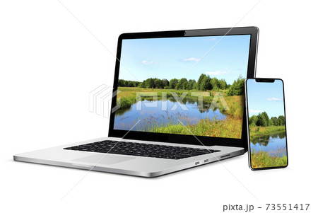 Laptop and phone with landscape wallpaper on screen Laptop and phone with landscape wallpaper on screen 73551417