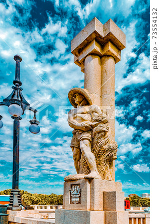 Statue on bridge in Valencia - third size population  city in Spain. 73554132