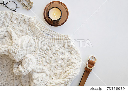 Feminine fashion flat lay with knitted sweater Feminine fashion flat lay with knitted sweater 73556039