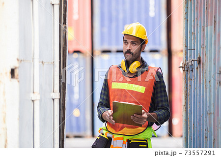 Foreman industrial logistic checking at container cargo. Foreman industrial logistic checking at container cargo. 73557291