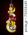 Fruit stack poured with chocolate on dark brown 73559185