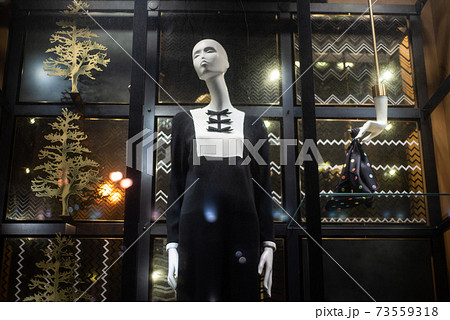 mannequins on a shop window in a black and white dress 73559318
