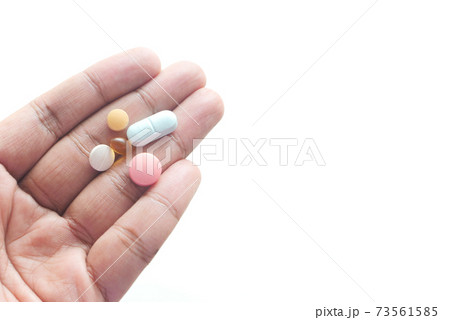 man's hand with pills and capsule isolated on white man's hand with pills and capsule isolated on white 73561585