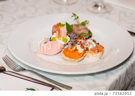 Served table for food and wine tasting. Snacks with shrimp, fish fillets, Spain tapas recipe food pintxos 73562052
