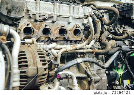 Close-up, internal combustion engine repair. Close-up, internal combustion engine repair. 73564422