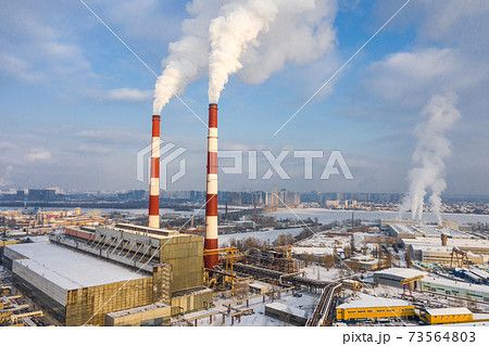 Garbage incineration plant in the big city at the winter aerial panorama view. Garbage incineration plant in the big city at the winter aerial panorama view. 73564803