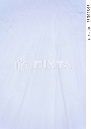 Ski track on a snow at sunset, Close up, copy space, The concept of winter sports. Ski track on a snow at sunset, Close up, copy space, The concept of winter sports. 73565348