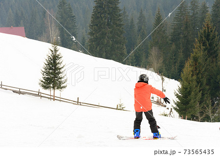 In the Ukrainian Carpathian village, children ski. In the Ukrainian Carpathian village, children ski. 73565435