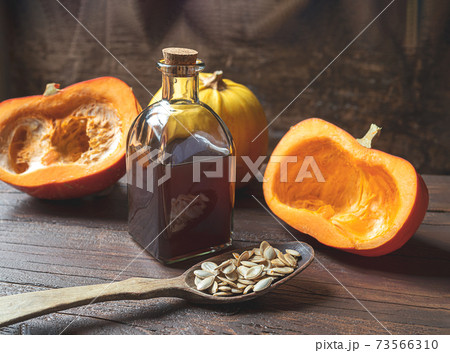 A bottle of organic pumpkin oil 73566310
