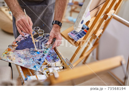 close-up photo of colourful paints palette in art studio 73568194
