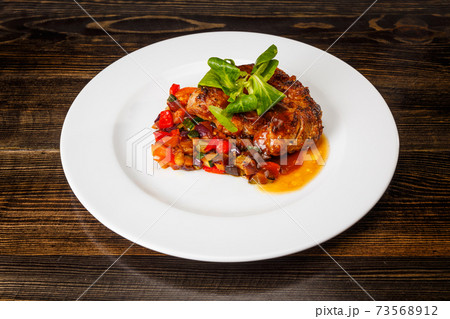 Juicy piece of meat with stewed vegetables Juicy piece of meat with stewed vegetables 73568912