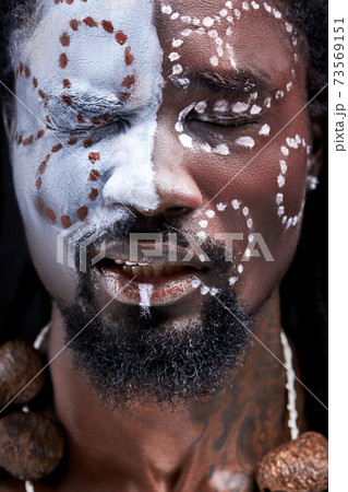 young african male feeling pain, stand with closed eyes 73569151