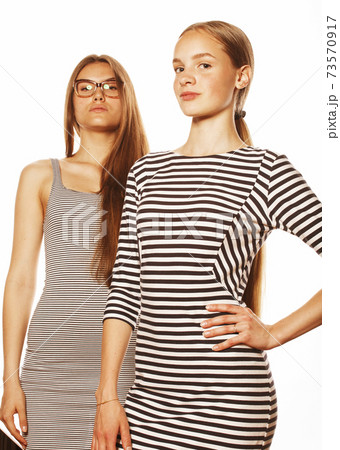 two young workers isolated on white, same dresses in strip 73570917