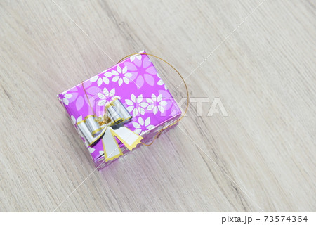 Pink gift box with silver bow. Pink gift box with silver bow. 73574364