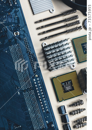 Top view of computer parts and components on white background with copy space. Top view, flat lay. Top view of computer parts and components on white background with copy space. Top view, flat lay. 73575955