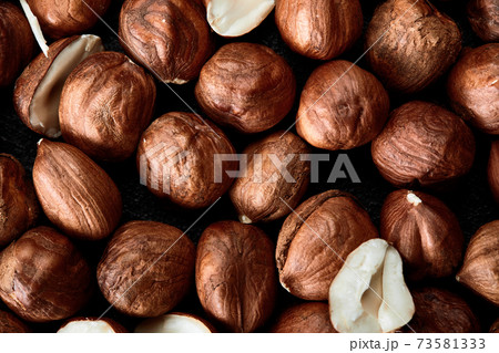 Close up of Hazelnut kernels - Food Frame Background, macro detailed close up. Close up of Hazelnut kernels - Food Frame Background, macro detailed close up. 73581333