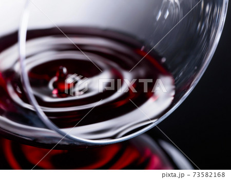 Glass of red wine, macro shot . Glass of red wine, macro shot . 73582168