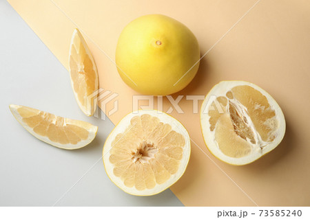 Ripe pomelo fruit on two tone background, top view 73585240