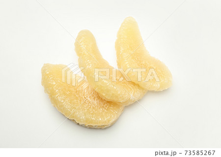 Ripe pomelo fruit slices on white background 73585267