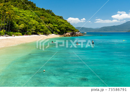 Fitzroy tropical Island beach in a sunny day Fitzroy tropical Island beach in a sunny day 73586791