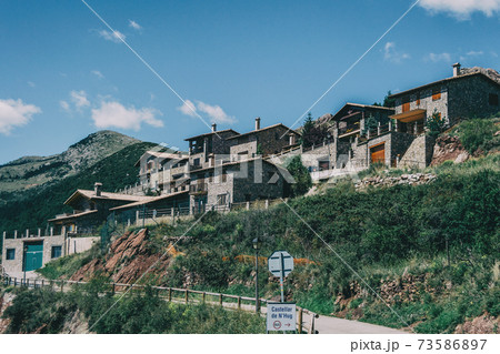 View of a small and rustic town in Catalonia, Spain. 73586897