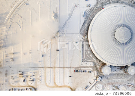 Top view in winter of a modern sports complex with parking in Minsk. Belarus Top view in winter of a modern sports complex with parking in Minsk. Belarus 73596006