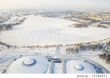 Top view in winter of a modern sports complex with parking in Minsk. Belarus 73596021