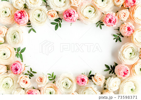 Floral pattern frame made of pink ranunculus and roses flower buds on white background. Flat lay, top view floral background. Floral pattern frame made of pink ranunculus and roses flower buds on white background. Flat lay, top view floral background. 73598371