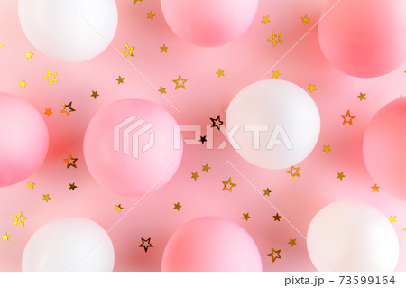 Balloons and confetti on pink background. Valentines day, Birthday, holiday concept. Flat lay, top view Balloons and confetti on pink background. Valentines day, Birthday, holiday concept. Flat lay, top view 73599164