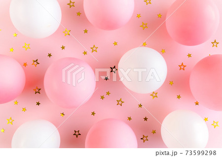 Balloons and confetti on pink background. Valentines day, Birthday, holiday concept. Flat lay, top view Balloons and confetti on pink background. Valentines day, Birthday, holiday concept. Flat lay, top view 73599298