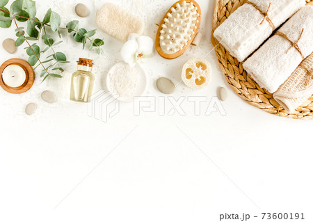 Spa Background. Natural, Organic spa cosmetics products, eco friendly bathroom accessories, eucalyptus leaves. Skincare concept on white background. Spa Background. Natural, Organic spa cosmetics products, eco friendly bathroom accessories, eucalyptus leaves. Skincare concept on white background. 73600191